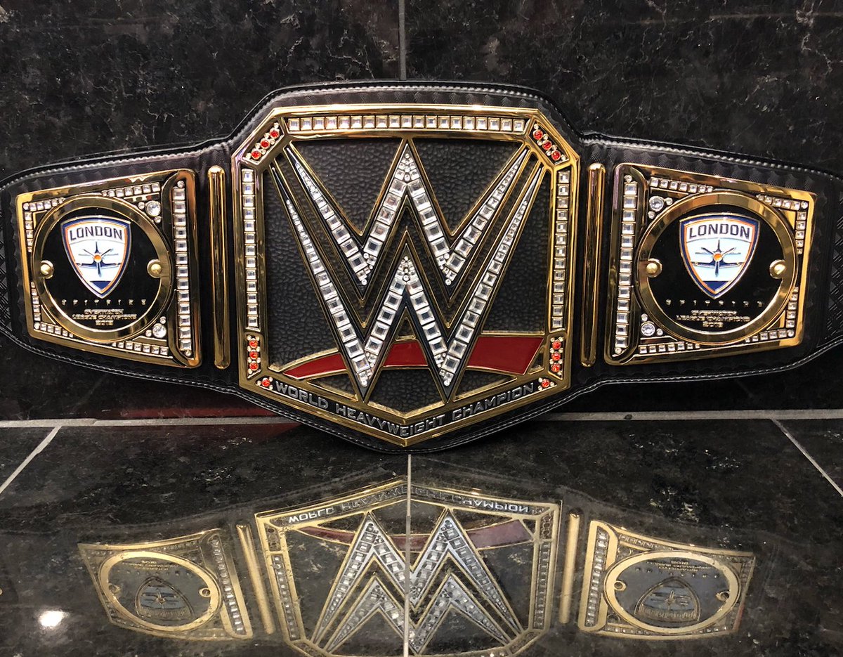 WWE Superstar Triple H gifts London Spitfire a custom WWE Championship belt