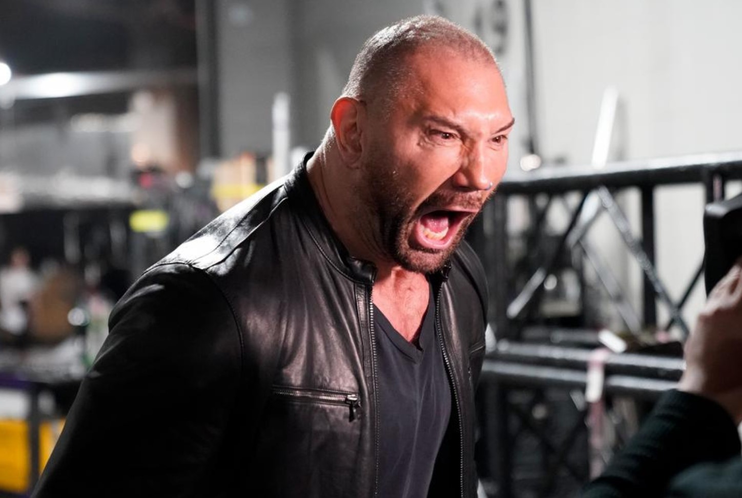 Batista returns to WWE, challenges Triple H and ruins Ric Flair's birthday