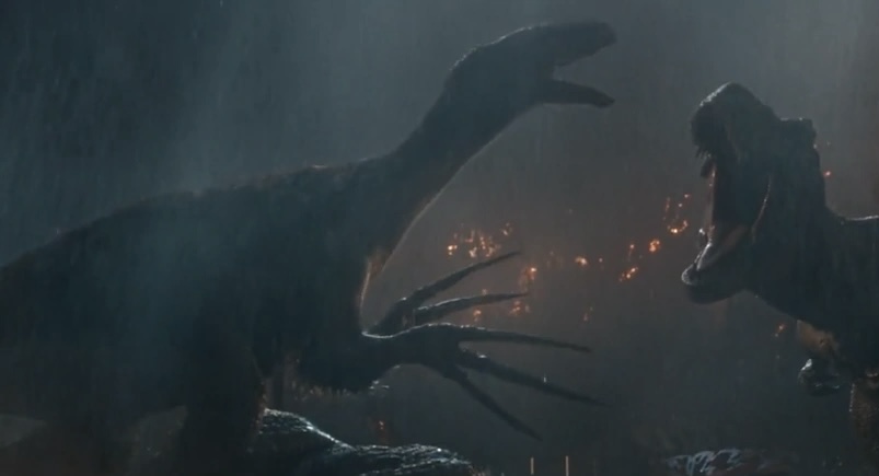 Therizinosaurus, a long-necked herbivorous dinosaur with hands ending in three long claws roars. Image is from the film Jurassic World : Dominion.