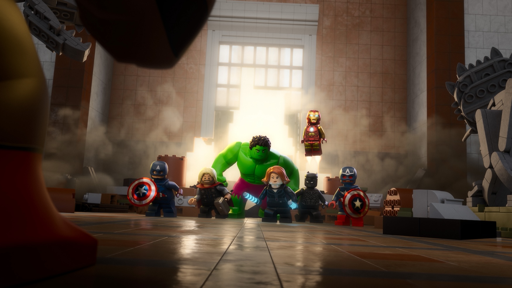 (L-R): Captain America (voiced by Roger Craig Smith), Thor (voiced by Travis Willingham), Hulk (voiced by Fred Tatasciore), Black Widow (voiced by Laura Bailey), Black Panther (voiced by James Mathis III), Iron Man (voiced by Mick Wingert), and Sam Wilson (voiced by Ogie Banks) in LEGO MARVEL AVENGERS: STRANGE TAILS.