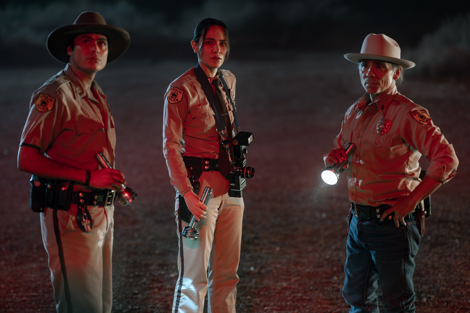 tv picks - Zahn McClarnon as Joe Leaphorn, Jessica Matten as Bernadette Manuelito and Kiowa Gordon as Jim Chee - Dark Winds _ Season 4, Episode 2