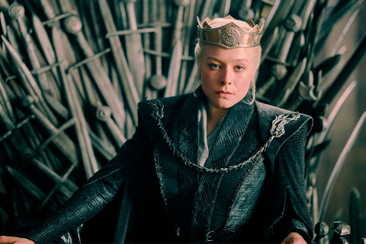 Queen Rheanyra Targaryen sits on the Iron Throne in House of the Dragon Season 3.